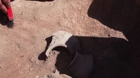 Archaeologists working, hand and tool Видео 76974907