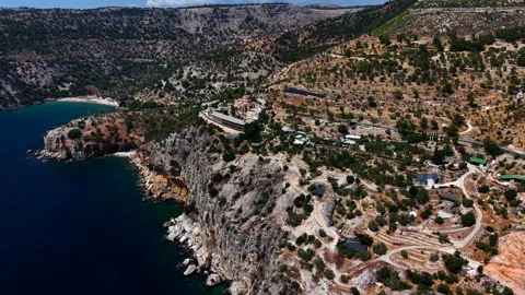 Archangelos Monastery on the cliffs above coves, Thassos, aerial Stock-Footage 347175966
