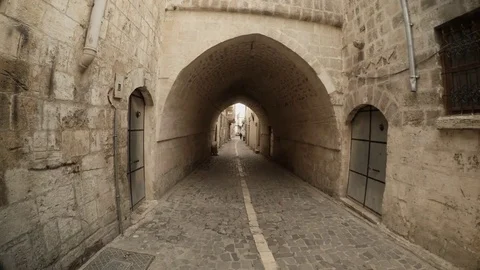 Arche From Overbuilt Passage Under Narrow Ancient Street Paved With Stones in Stock Footage 75416264