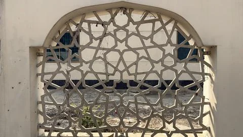 An arched architectural element with a cream-colored frame enclosing a detail Stock Photos