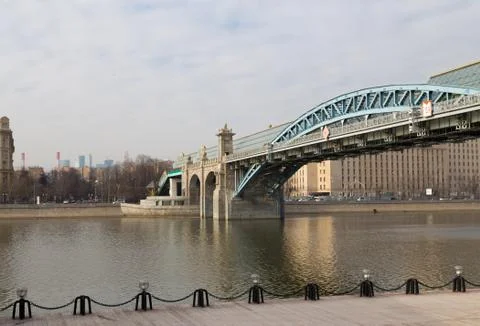 Arched bridge over the river Stock Photos