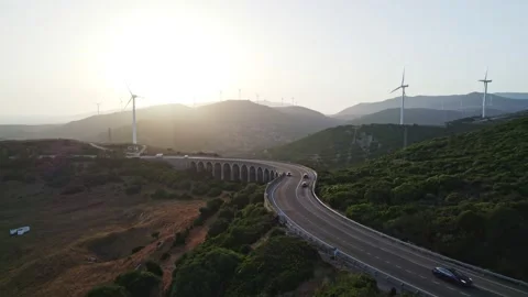 Arched bridge, sunset and windmills Stock Footage 234448547