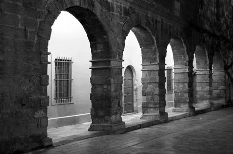 Arched building facade in central square of Nafplio city .Greece Stock Photos