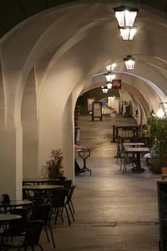 Arched cafe arcade at night Stock Photos