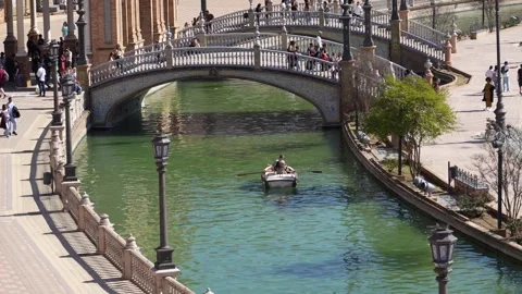 Arched ceramic tile bridge crossing the canal in Seville, Spain Stock Footage 346799198