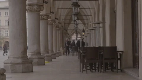 Arched Colonnade with Hanging Lanterns and Cafe Seating Stock Footage 342558501