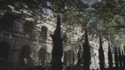 Arched Colonnade of a Heritage Building Through Iron Fencing Stock Footage 343883242