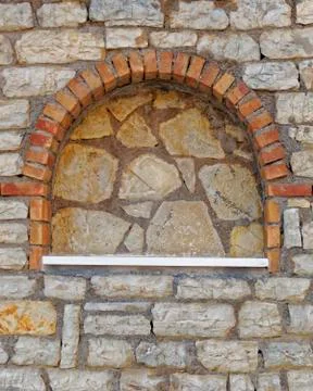 Arched frame on stone wall Stock Photos