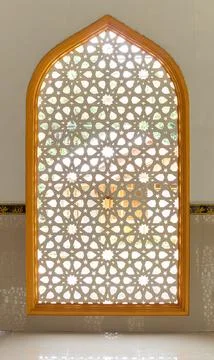 Arched Islamic Geometric Pattern Window Screen with Golden Frame and Backligh Stock Photos