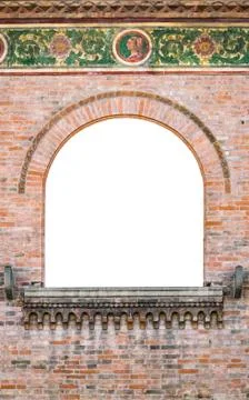 Arched medieval window suitable as a frame. 库存照片
