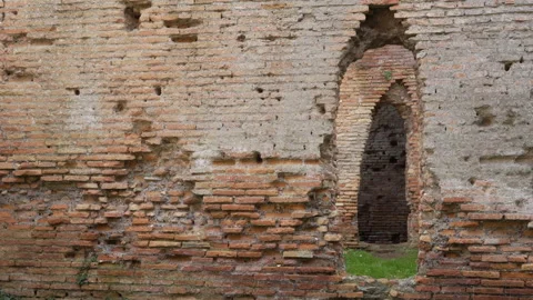 Arched Opening in Old Wall at Ancient Roman Buildings, Ostia Anitca Stock Footage 345736588