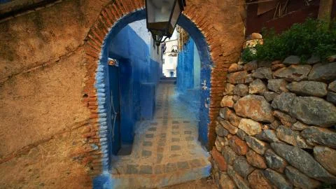 An arched passageway separating the two streets Stock Photos