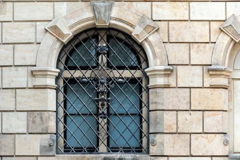 Arched window with bars. Stock Photos