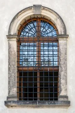 Arched window with bars. Stock Photos
