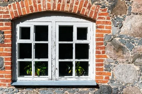 Arched window in brick. Stock Photos
