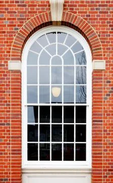 Arched window brick wall Stock Photos