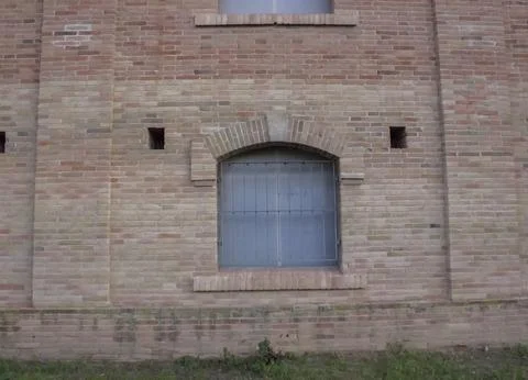 Arched window in a brick wall Stock-Fotos