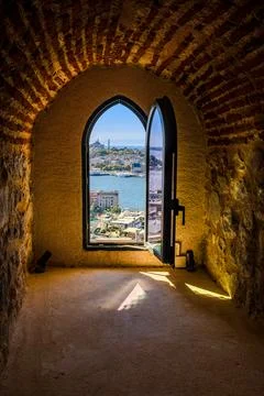 Arched window frames a vibrant Istanbul skyline Stock Photos
