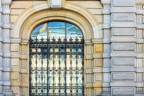 Arched window with a lattice. Stock Photos