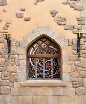 Arched window in stone wall 스톡 사진