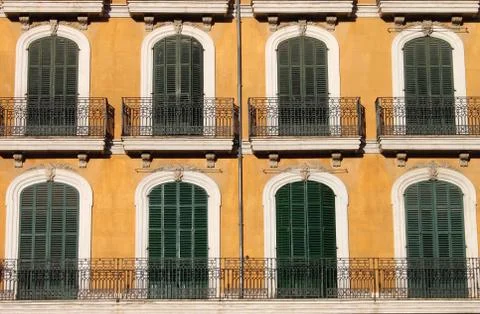 Arched windows with balcony Stock Photos