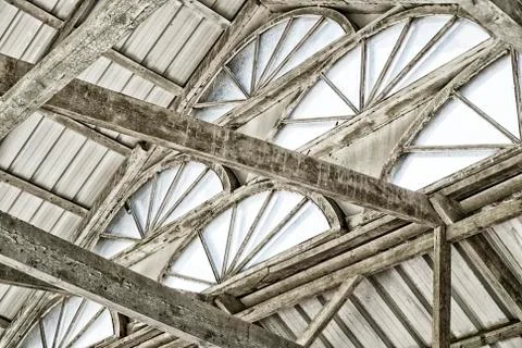 Arched Windows under the dome made of tin sheets and wooden beams Stock Photos