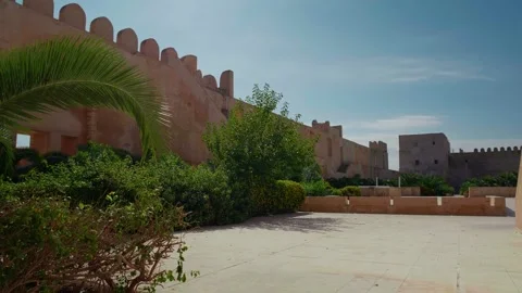 The Archeological Museum Of Sousse an ouside view of walls and vegetation. Stock Footage 296384513