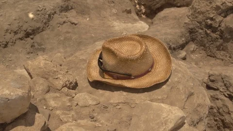 An Archeologists hat rests on an excavation dig site Stock Footage 89008402