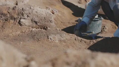 Archeology, Archaeological Site, Working With Brush. Close up Sand. Excavation Stock Footage
