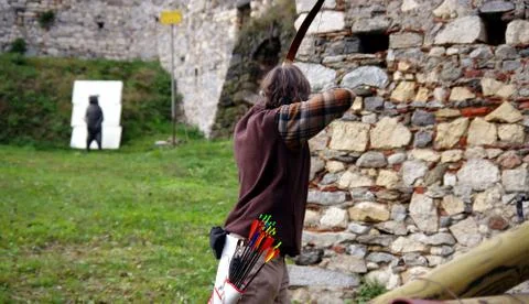 Archer aiming back view Stock Photos