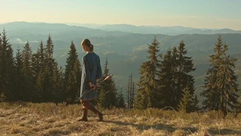 Archer in costume hunting in the mountain forest Stock-Footage 80498965