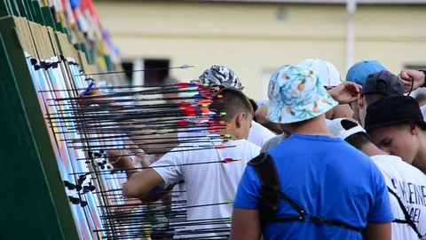 Archers pull their arrows out of targets. Stock-Footage 116117046