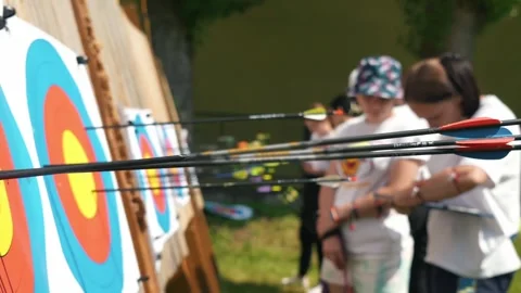 Archery competition, athletes look at their results on the target after shooting Stock Footage 274759375