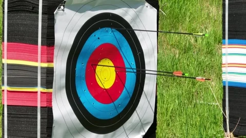 Archery multiple arrows hitting target and bullseye with consistency, closeup Stock Footage 306684269
