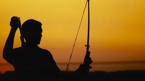 Archery silhouette, sun sets behind the archer. Young hunter. Stock Footage 65070374