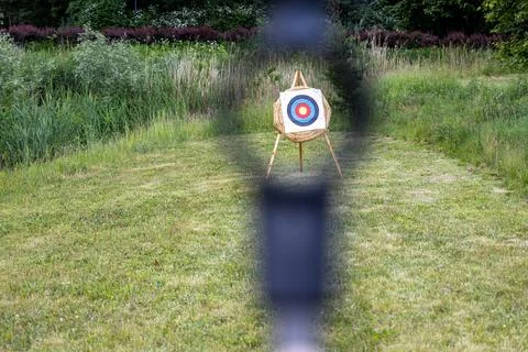 Archery target view through bow sight for outdoor team building event activities Stock Photos