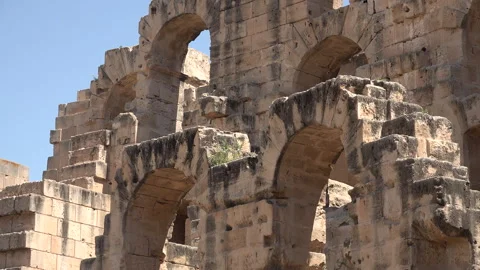 Arches in the El Jem Ampitheatre, historic landmark and tourism Tunisia Stock Footage 328633681