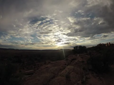 Arches in Moab, Utah with rolling clouds at sunset over canyon Video stock 11843760