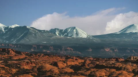 Arches National Park Time lapse video loop. Red rock formations and snow capped Video stock 346422022