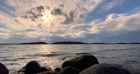 Archipelago clouds highlighted by the sun Stock Footage 134052899