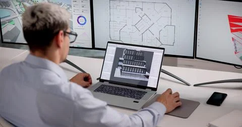 Architect Analyzes 3D BIM Model To Enhance Building Design And Project Planni Stock Photos