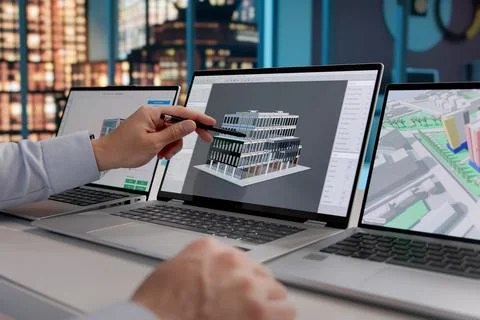 Architect Analyzes 3D Digital Models On Laptop With BIM Software At Night, En Stock Photos