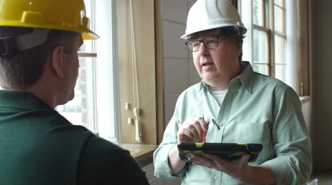 Architect and contractor talking with tablet Video stock 49083810