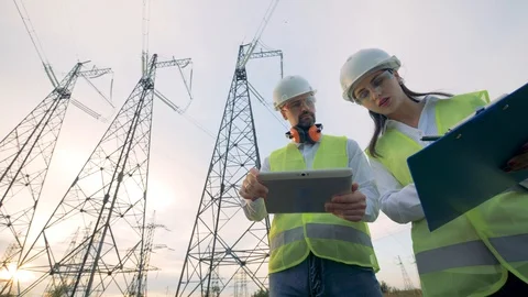 Architect and engineer checking construction project on tablet. 4K. Stock Footage 94116985