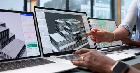 Architect And Engineer Collaborate On 3D BIM Model Using Laptop Software. Stock Photos