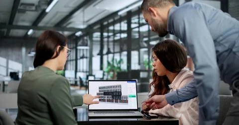 Architect And Engineer Collaborate Using 3D BIM Software For Building Design. Stock Photos