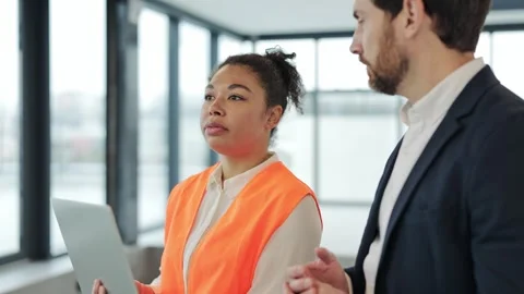 Architect and Engineer Discuss Project in Modern Office Stock Footage 308438488