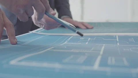 Architect and Engineer in a team discussing house blueprints Video stock 133054335