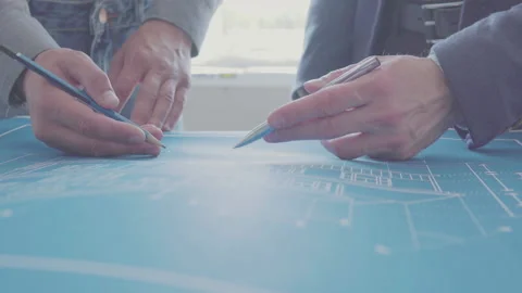 Architect and Engineer in a team discussing house blueprints Video stock 133054658