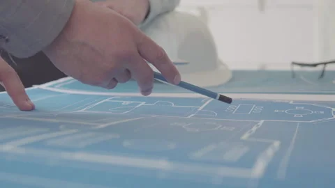 Architect and Engineer in a team discussing house blueprints Video stock 133054798